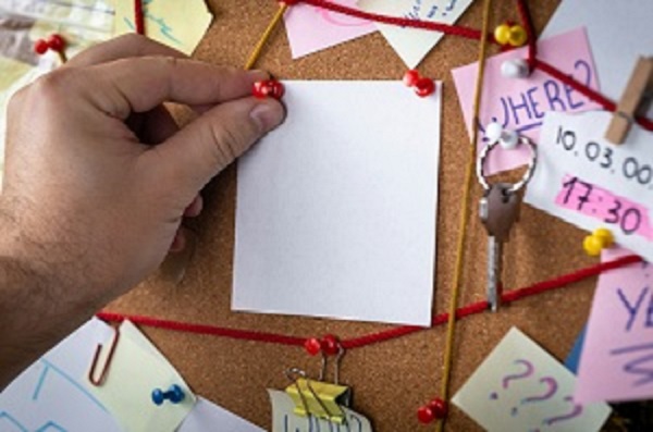 Image showing paper pinned to cork board.